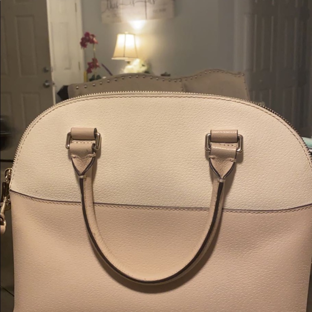 Tan cross body/ carry purse.